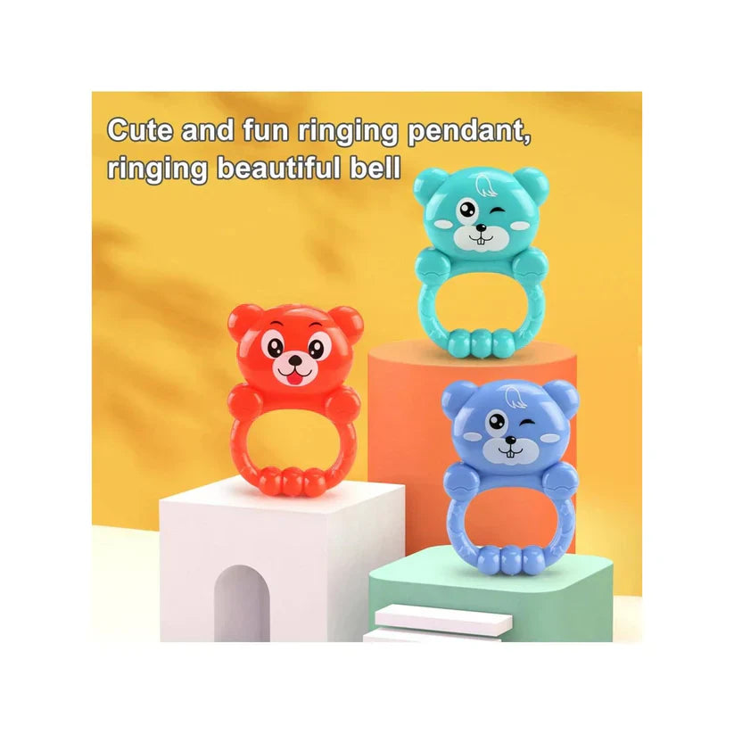 Three colorful bear-shaped rings with bells on a yellow background