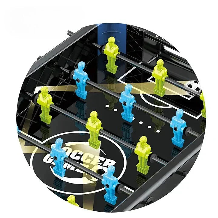 Futbol Mini table football game with green and blue figures on a black base.