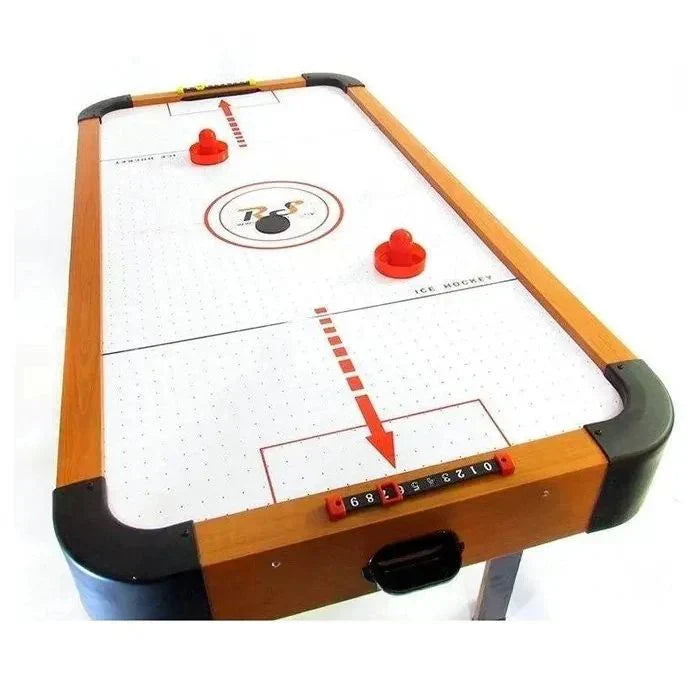 Air hockey table with red pucks and a white background