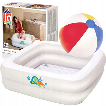 Children's inflatable pool with fish pattern on a white background