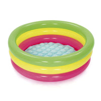 Set of three colorful inflatable rings on a white background