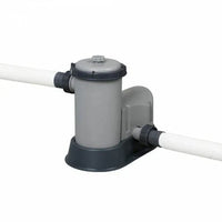 Gray pool pump with white pipes on a white background