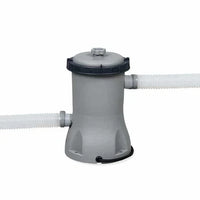 Gray pool filter with two white hoses on a white background