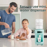 Man and child with a mini water dispenser in a kitchen setting