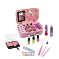Pink makeup set with various cosmetic items on a white background