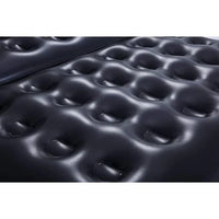 Close-up of an inflatable mattress with a pattern of raised dome shapes.