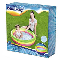 Red inflatable pool ring on a white background