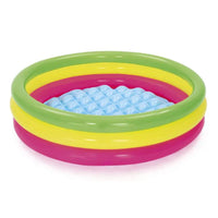 Inflatable children's pool with colorful rings on a white background