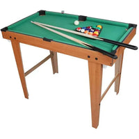 Small pool table with green felt surface, wooden frame, and billiard balls on a white background.