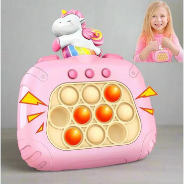 Pink toy with unicorn design and pop-it feature on a gray background