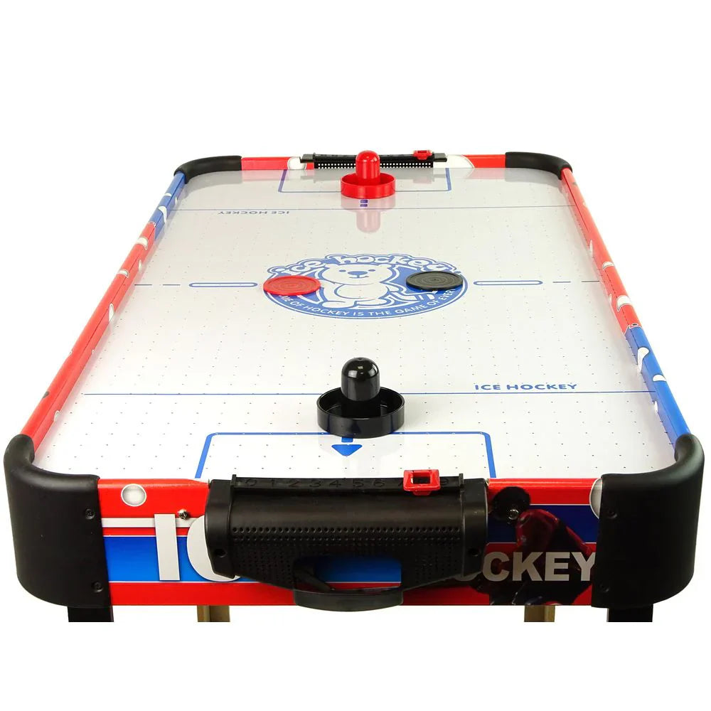 Air hockey table with red, blue, and white design on a white background