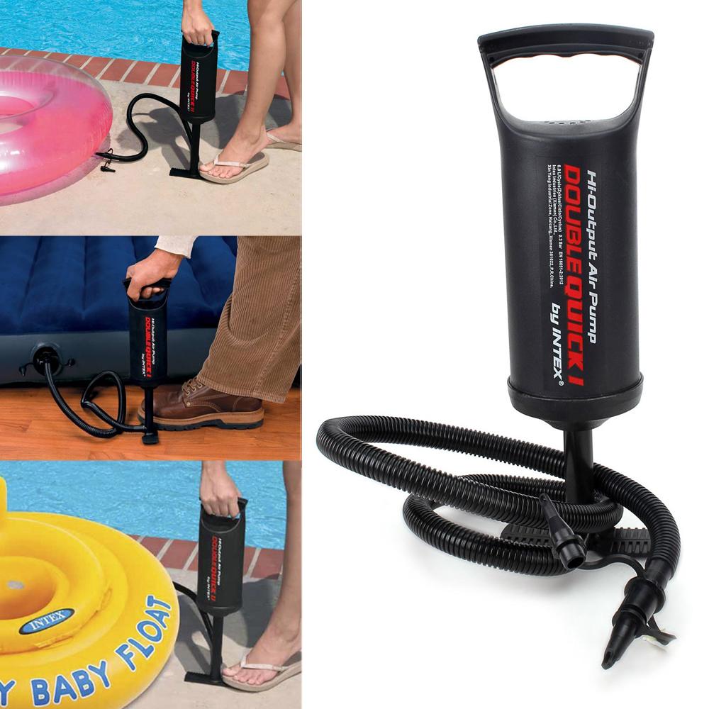 Black air pump with coiled hose on a white background, used for inflating pool toys.