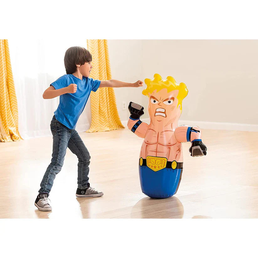 Child playing with a toy figure of a muscular character in a room with yellow curtains.