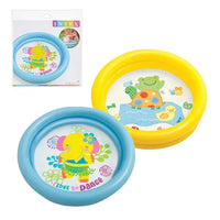 Pink inflatable pool with colorful design on a white background