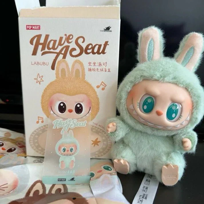 Plush toy and packaging of 'Have A Seat' Labubu character from Pop Mart.