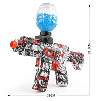 Graffiti-style water gun with blue water in the chamber on a white background