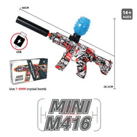 Miniature M416 toy gun with USB charging cable and crystal bomb on a white background