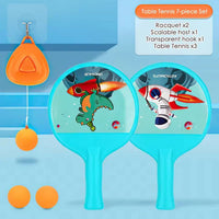Table tennis set with cartoon designs on rackets and balls on a blue background
