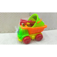 Colorful toy dump truck with red wheels on a textured surface