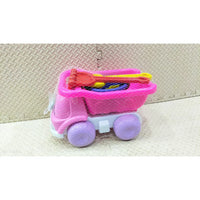 Pink toy truck with purple wheels on a textured surface