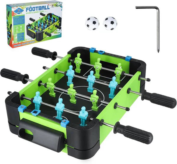 Tabletop foosball game set with green and black table, figures, and accessories on a white background.