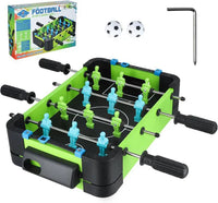 Tabletop foosball game set with green and black table, figures, and accessories on a white background.