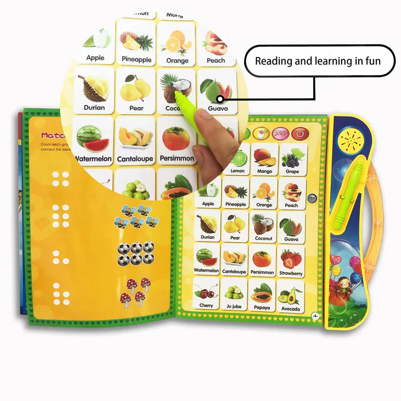 Educational book with fruit illustrations and a pointing device, labeled 'Reading and learning in fun'.