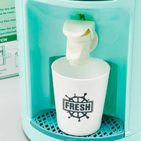 White cup with 'FRESH' logo being filled with water from a teal dispenser.