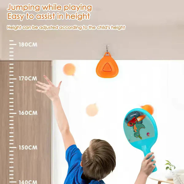 Child playing with a racket and ball, reaching towards an adjustable height measurement on the wall.