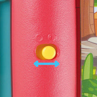 Close-up of a red toy door with a yellow lock and blue handle, part of a children's playset.