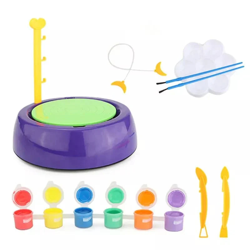 Children's art and craft set with paint, brushes, and other tools on a white background