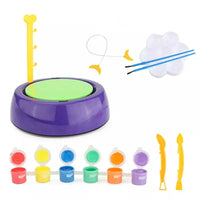Children's art and craft set with paint, brushes, and other tools on a white background