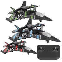 Three black toy drones with color-coded wings and a remote control on a white background
