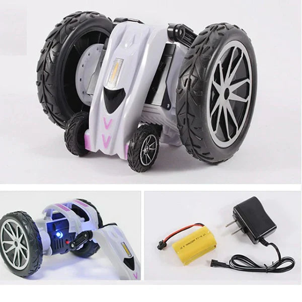 Toy robot with large wheels, battery pack, and adapter on a white background