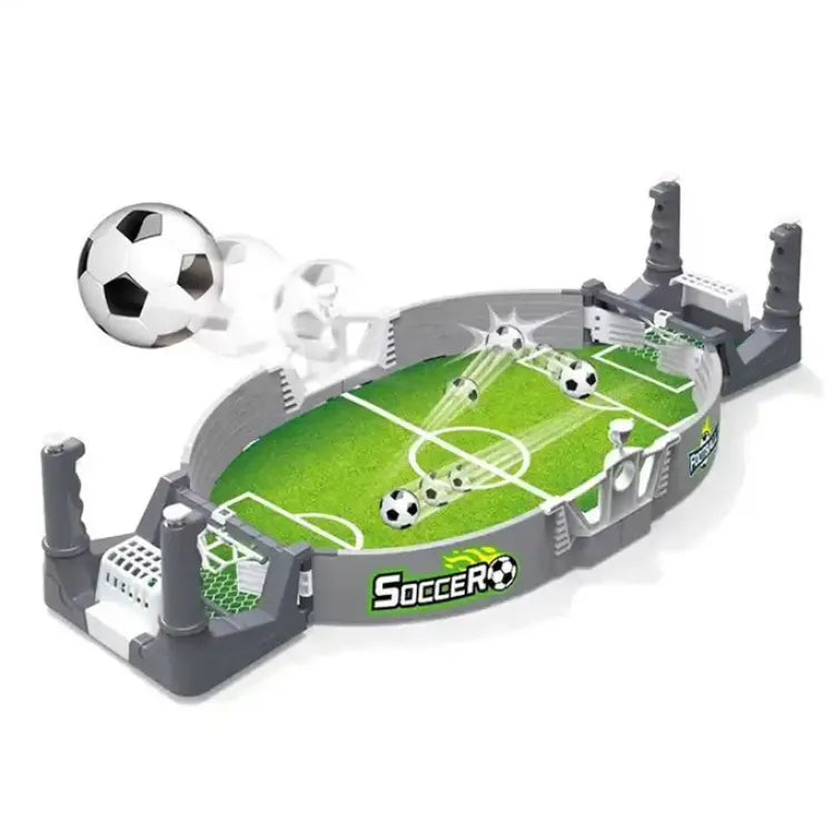 Tabletop soccer game with miniature players and a ball on a white background